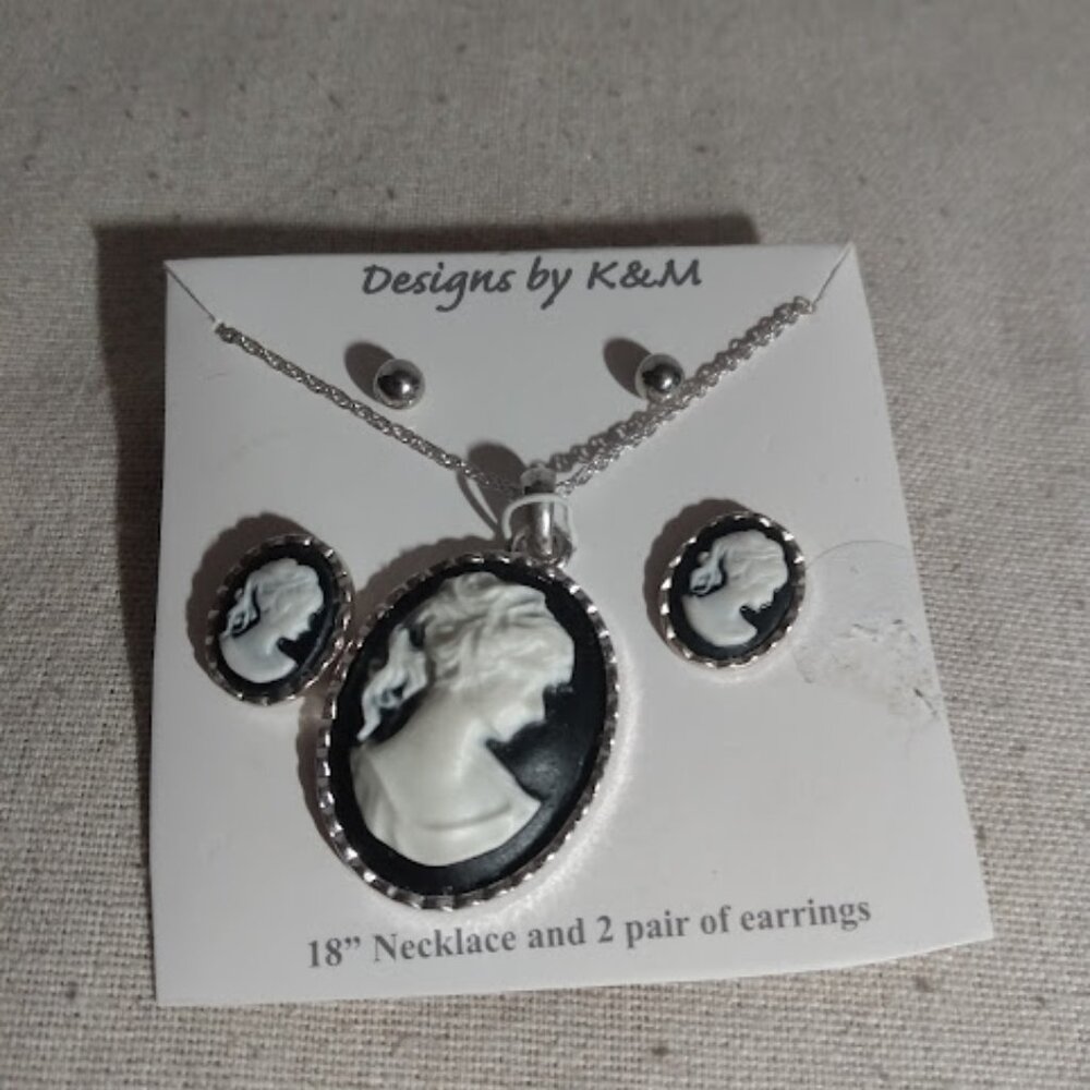Designs by K&M. Cameo design 18" necklace and 2 pair of earrings.